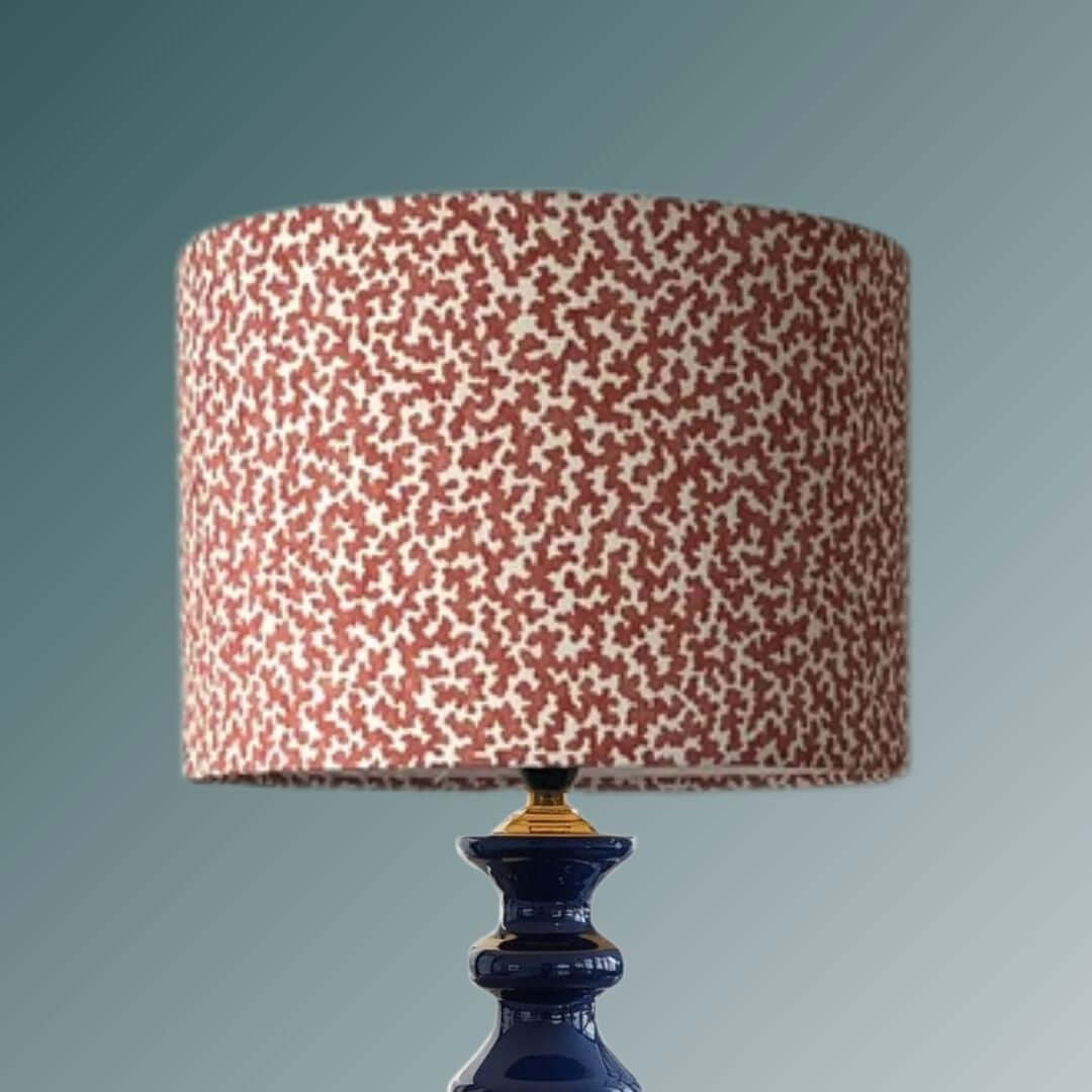 Romo Junie Pimento drum lampshade shown on a bllue lampbase 
