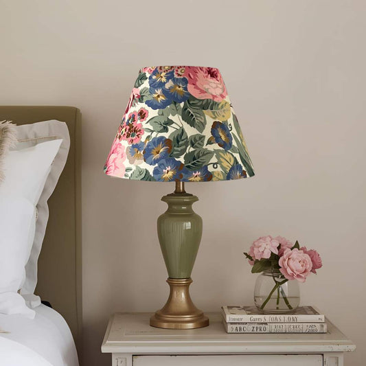 Rose and Peony empire conical floral lampshade shown on a lgreen lampbase on a bedside table 