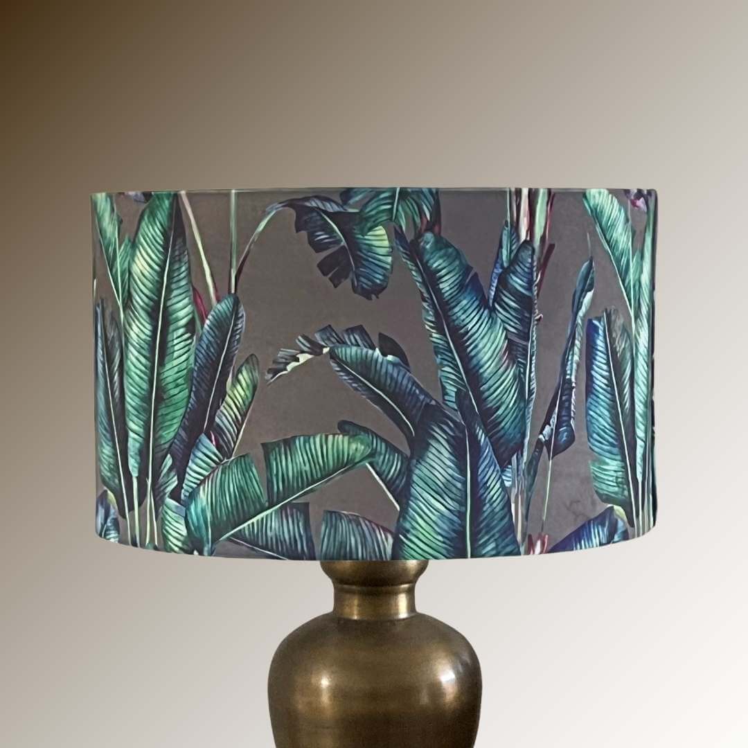 Tropical-palm-leaves-drum-lampshade-on-brass-lamp