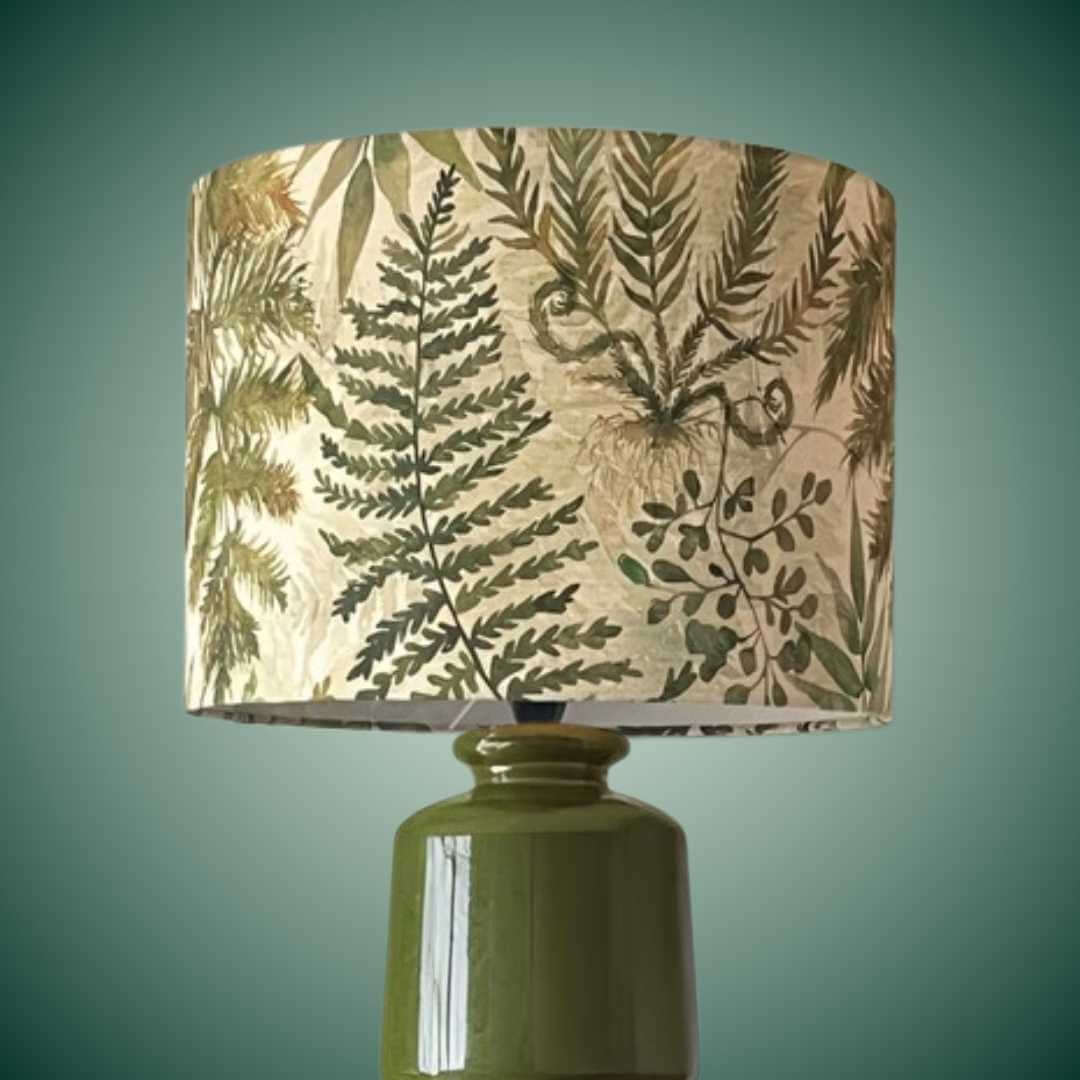 Voyage Maison Elowen drum lampshade with ferns and leaves on a green lamp base