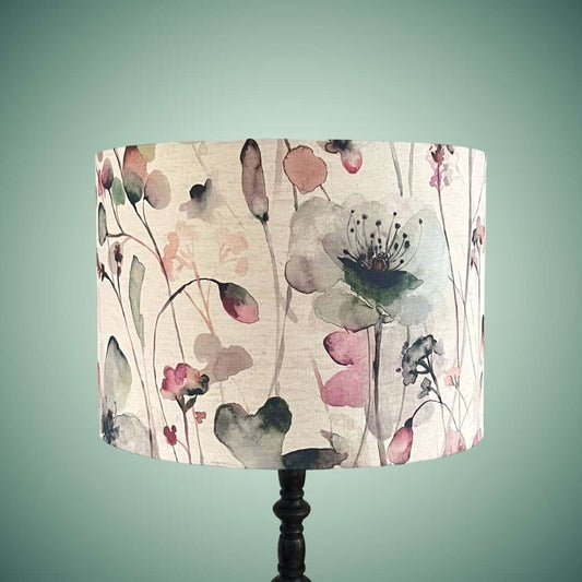 Drum lampshade in a watercolour style floral fabric by voyage maison on a standard lamp