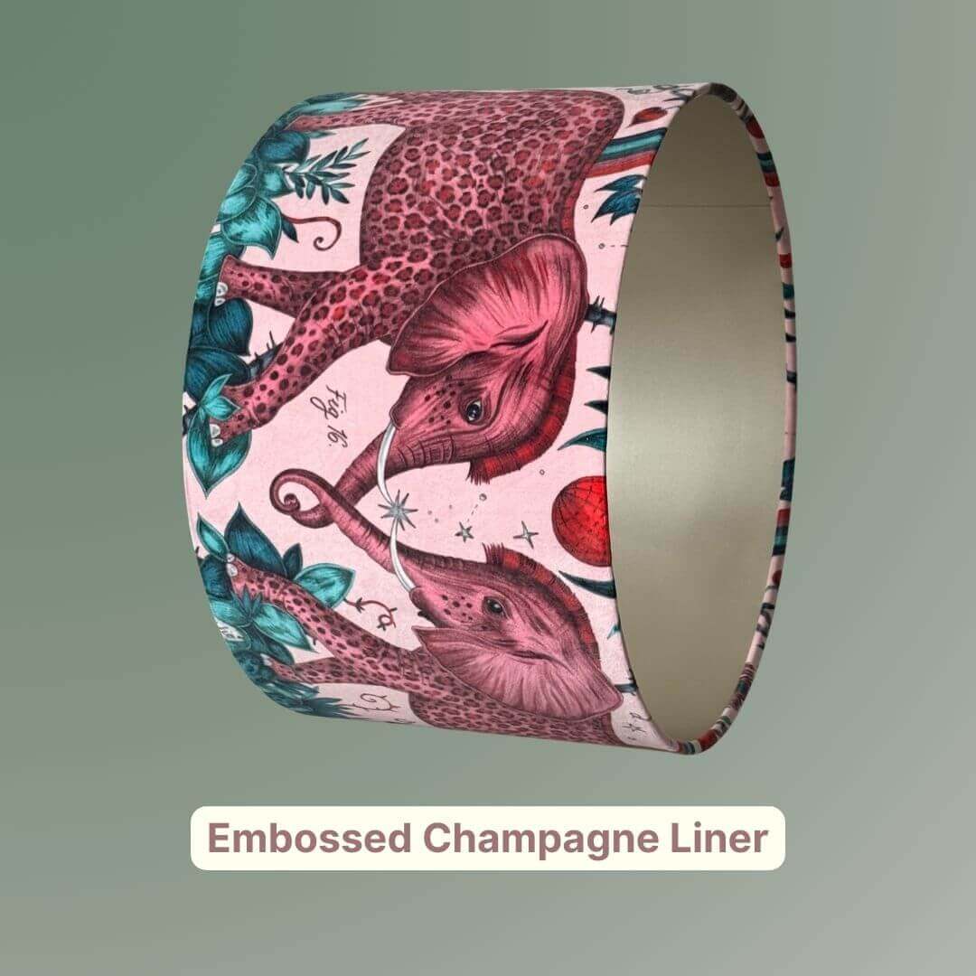 Emma Shipley Zambezi design Lampshade with elephants and jungle foliage on a pink velvet background with an embossed champage liner