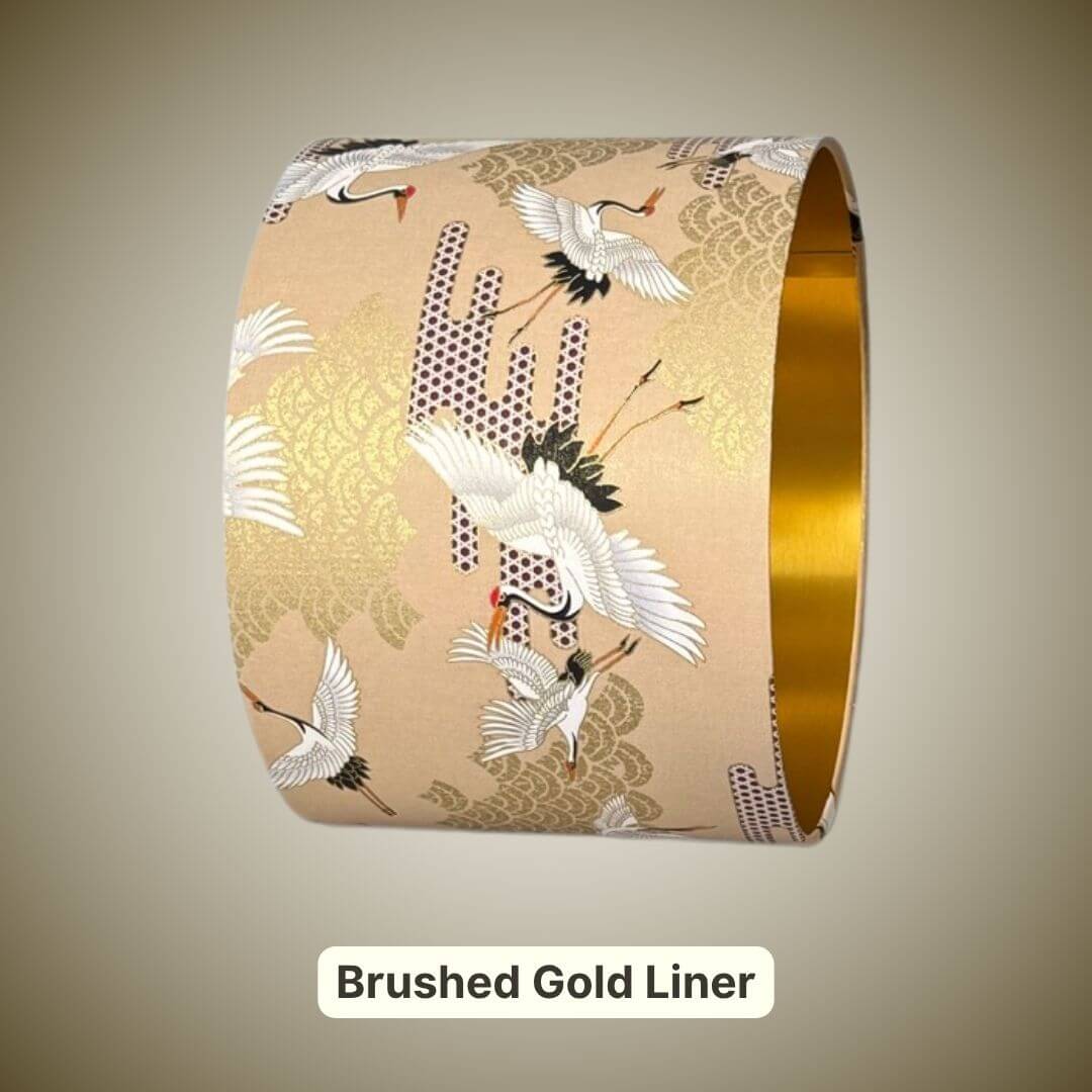Lampshade featuring cranes in flight and Art Deco style clouds in beige, white, red and gold with a  brushed gold liner
