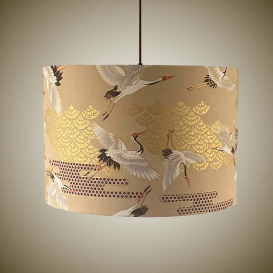 Lampshade featuring cranes in flight and Art Deco style clouds in beige, white, red and gold