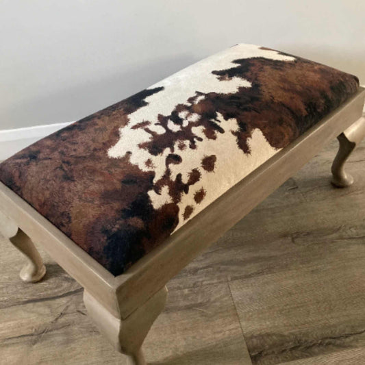 vintage footstool restored and reupholstered in luxury cowprint velvet