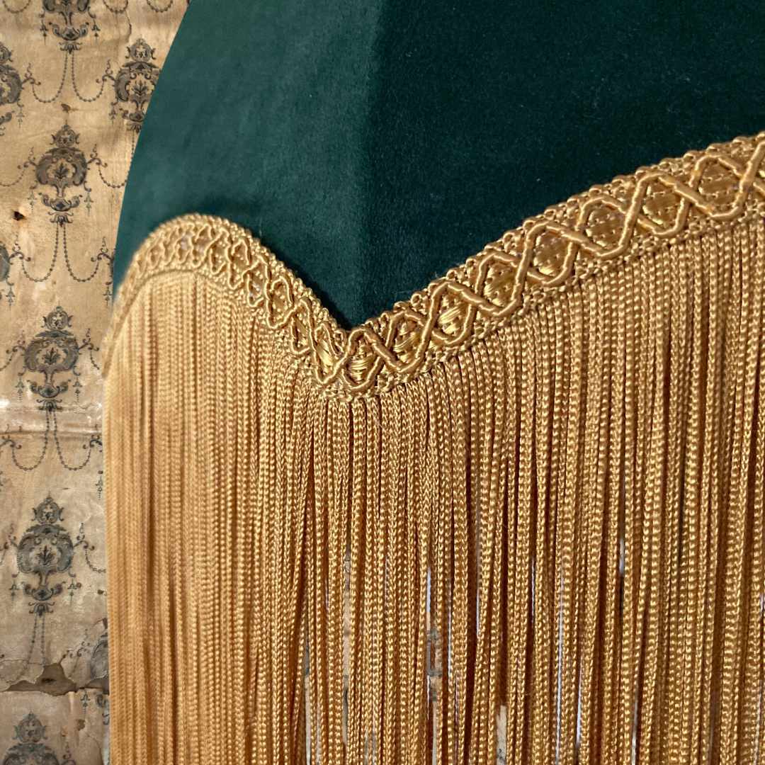 vintage style parachute lampshade in Green velvet with deep gold fringe topped with braid close up 