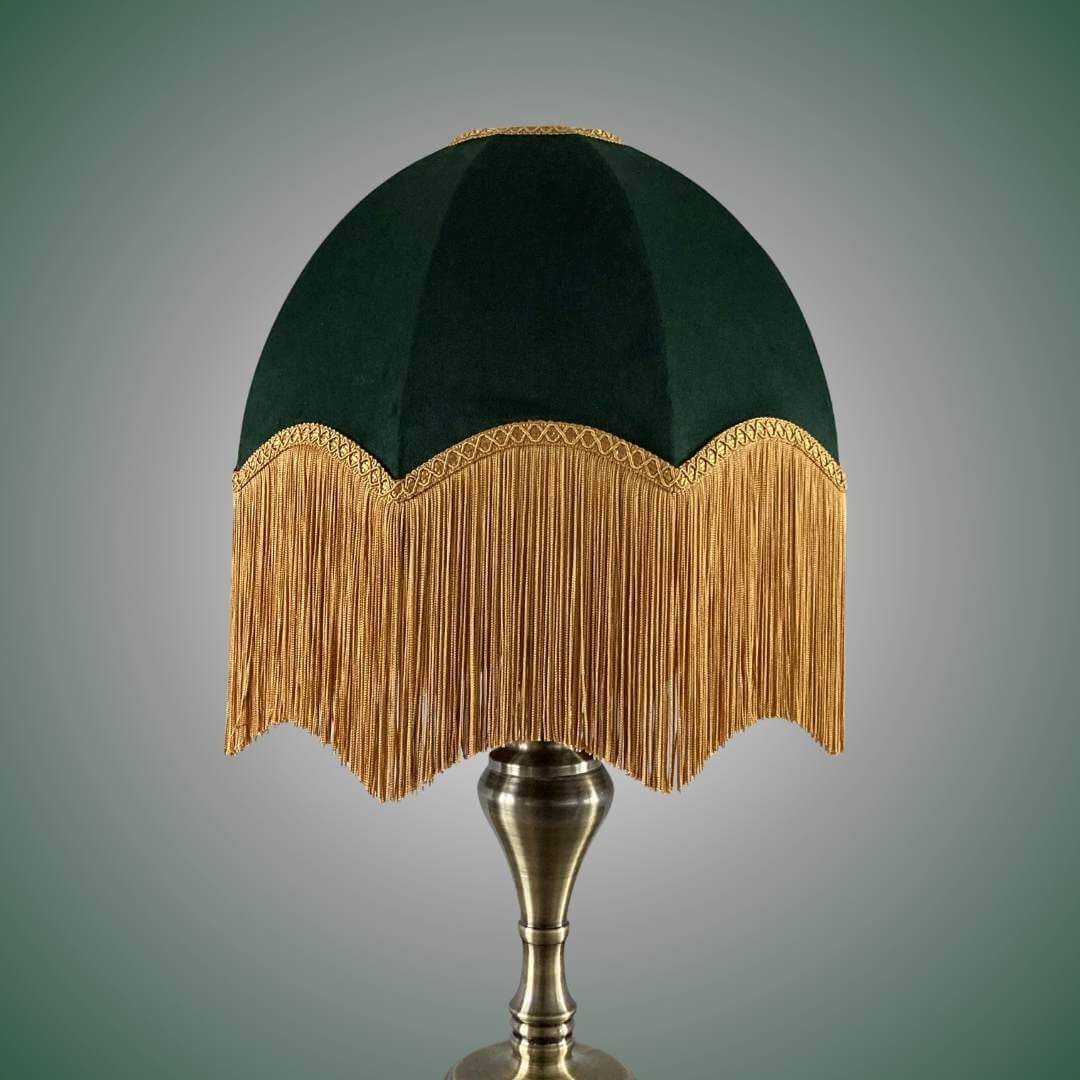 vintage style parachute lampshade in Green velvet with deep gold fringe topped with braid on brass lamp base