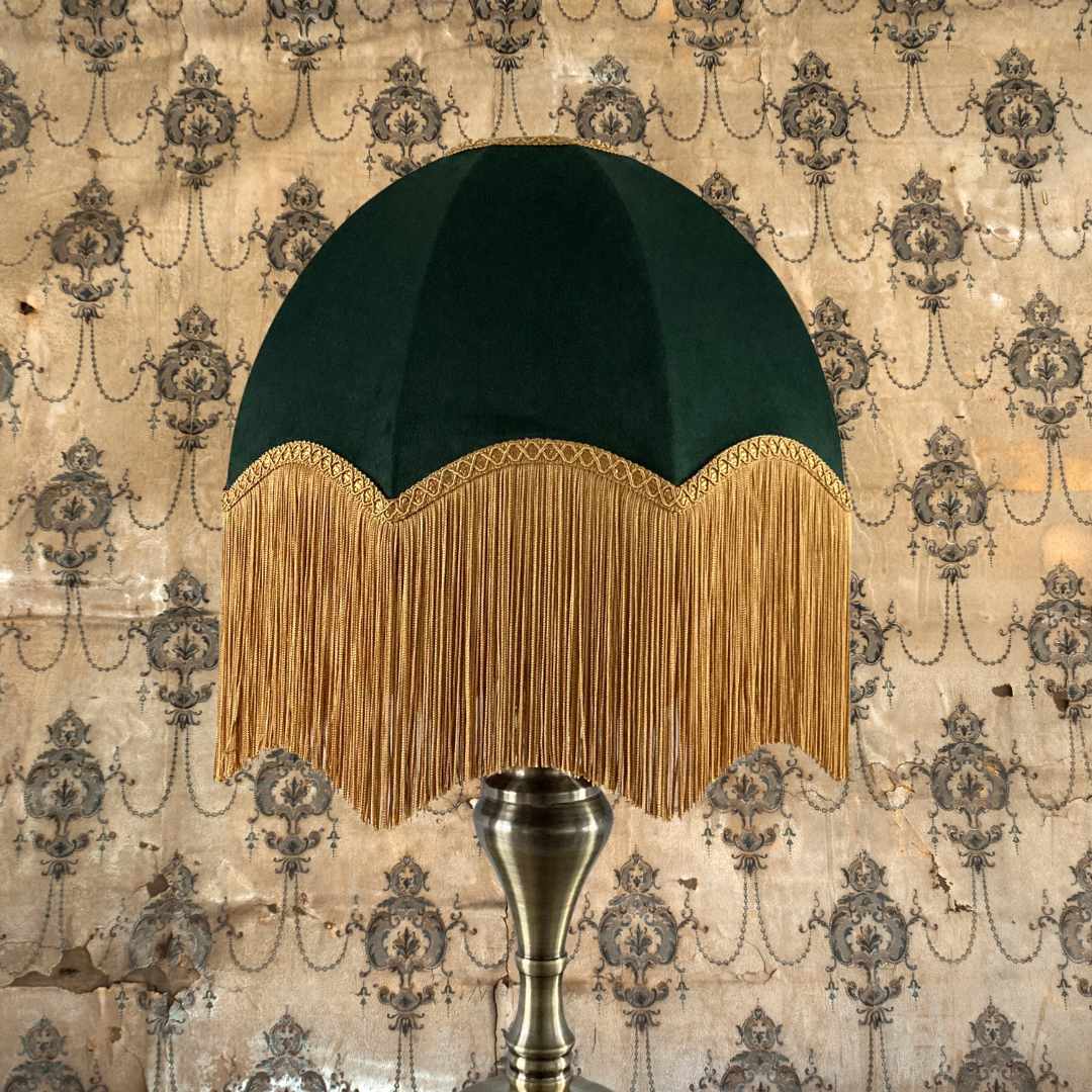 vintage style parachute lampshade in Green velvet with deep gold fringe topped with braid on brass lamp base