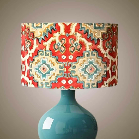 Lamp with a colourful geometric-patterned shade on a blue lampbase