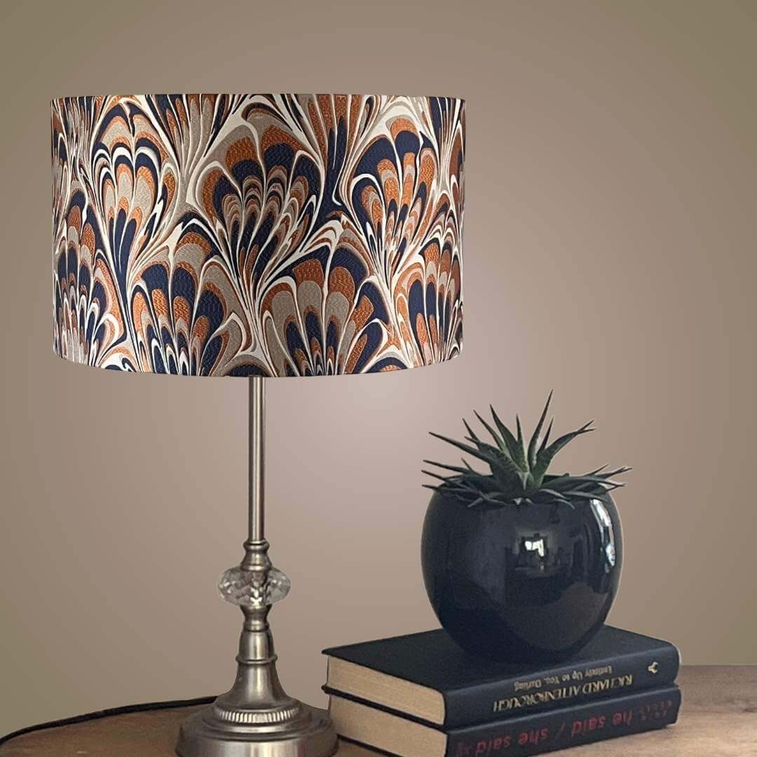 Orange and Navy Blue feather marble patterned lampshade on table 